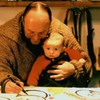 Robert sitting on Rinpoche’s lap